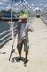 Thailand: Angler at Ban Laem Kruat pier, ferry point for the islands of Ko Si Boya and Ko Jam, Krabi Coast